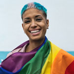 woman wearing rainbow flag