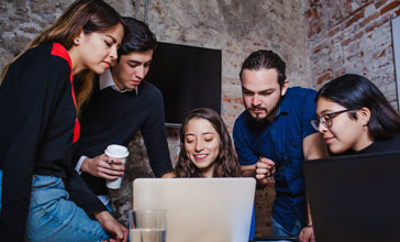 group of young people collaborating