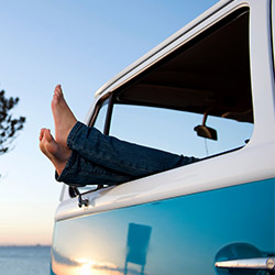 Person relaxing in a camper van