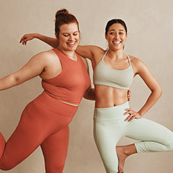 Two women doing yoga together