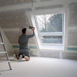 man doing drywall