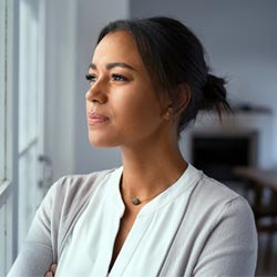 woman looking through the window