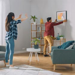 Couple decorating their living room
