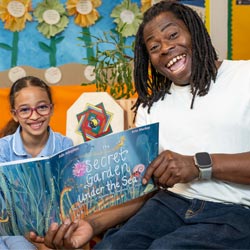 Ade Adepitan reading books