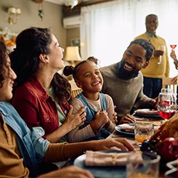 Happy family eating dinner