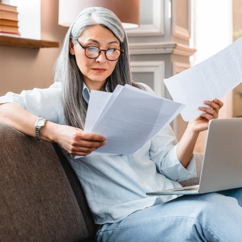 mature woman working at home with laptop