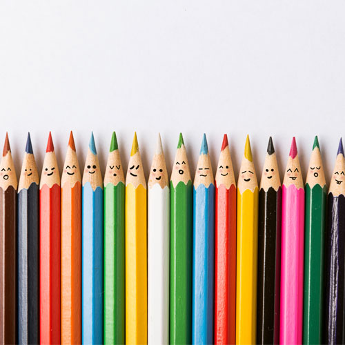 Colour pencils with faces painted on them