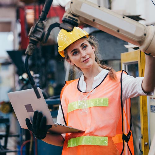 female engineer inspecting machinery