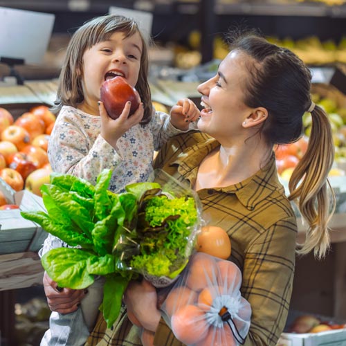 happy mum and daughter shopping