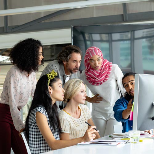 group of young people working together in the office