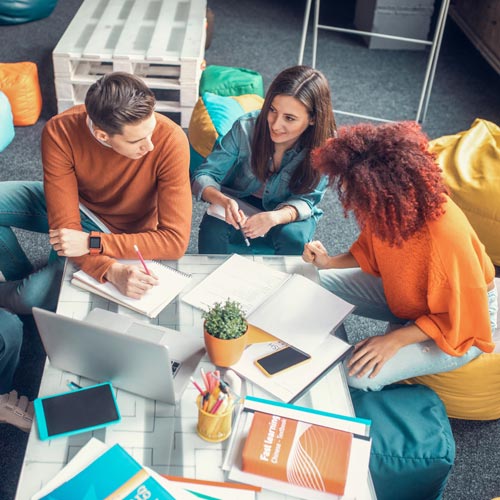 group of young people working together in the office