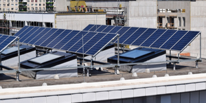 angled solar panels sitting on flat roof