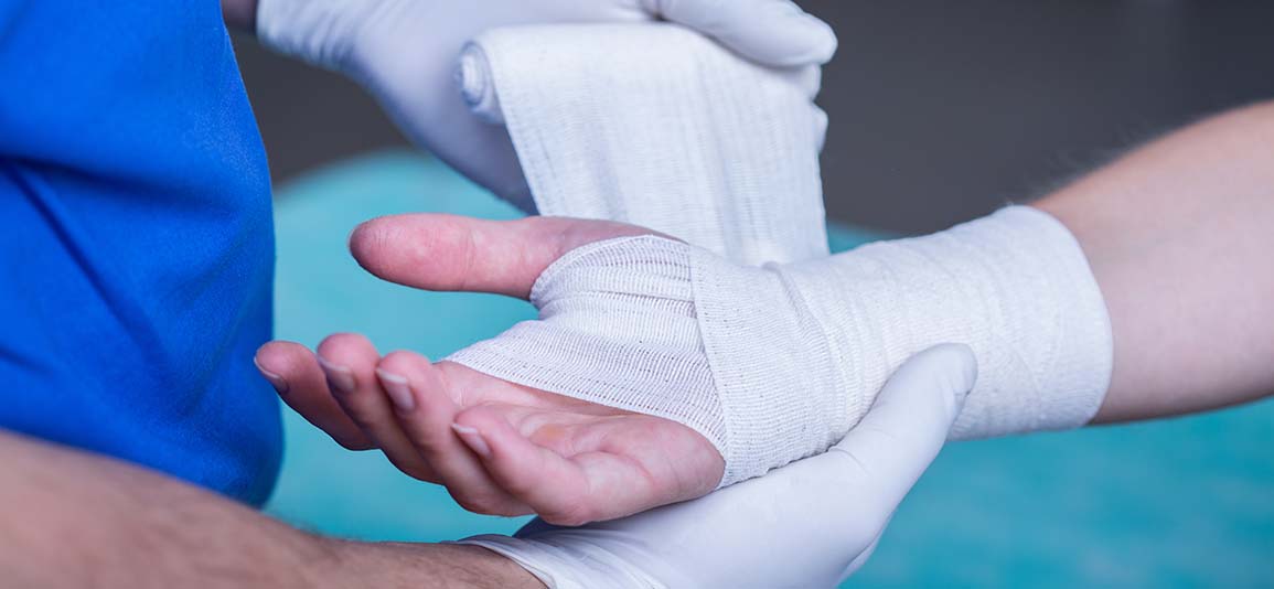 Doctor treating hand 