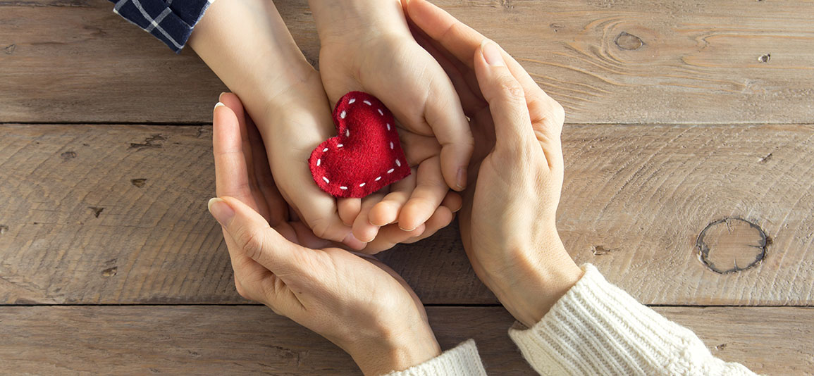 hands holding heart