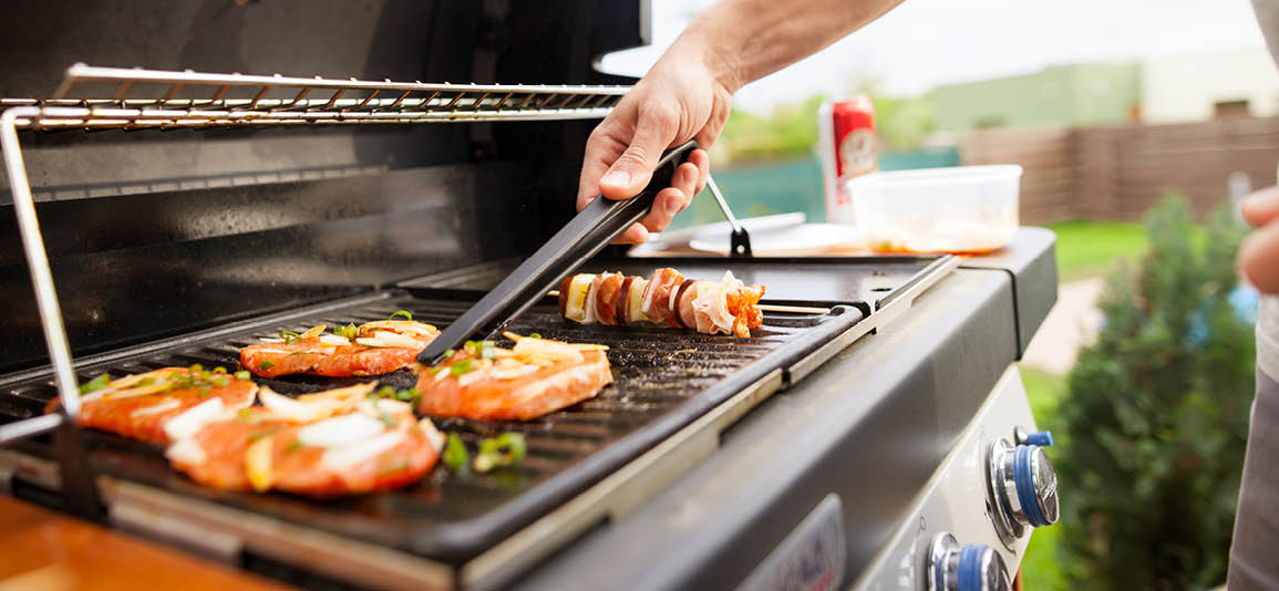 Close up on BBQ food cooking on a BBQ Grill