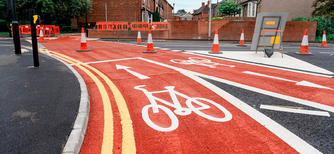 New cycling path made of red asphalt