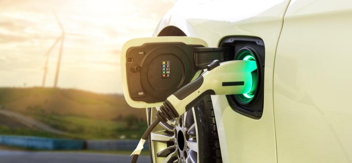 Electric car or EV car charging in station