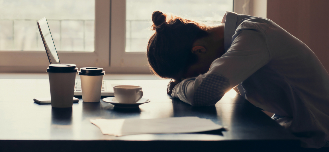 woman tired at her desk