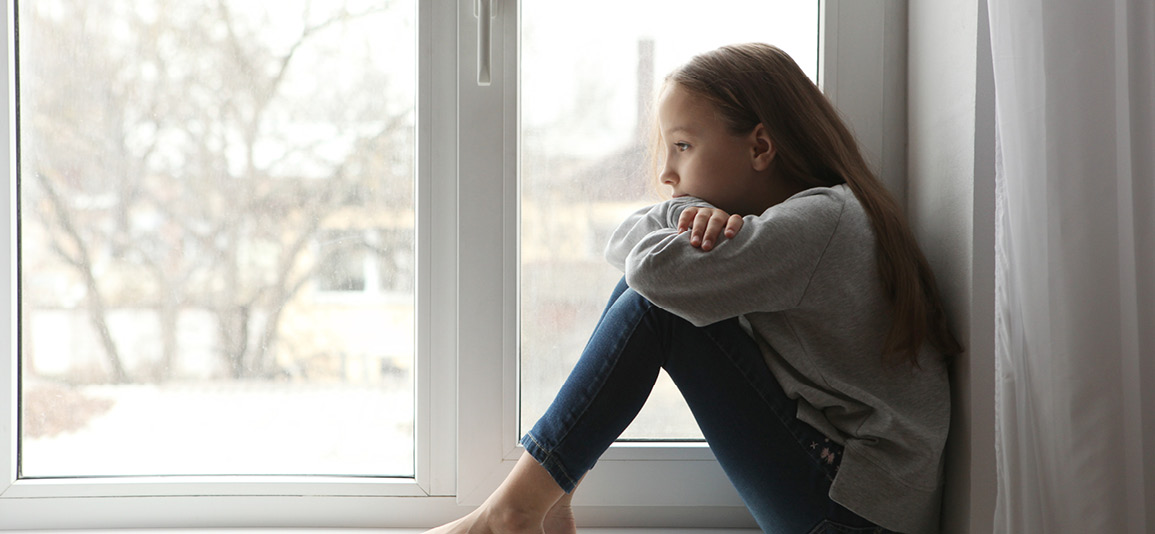 Lonely sad girl at home