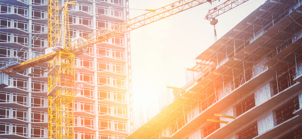Under construction high-rise building yellow crane
