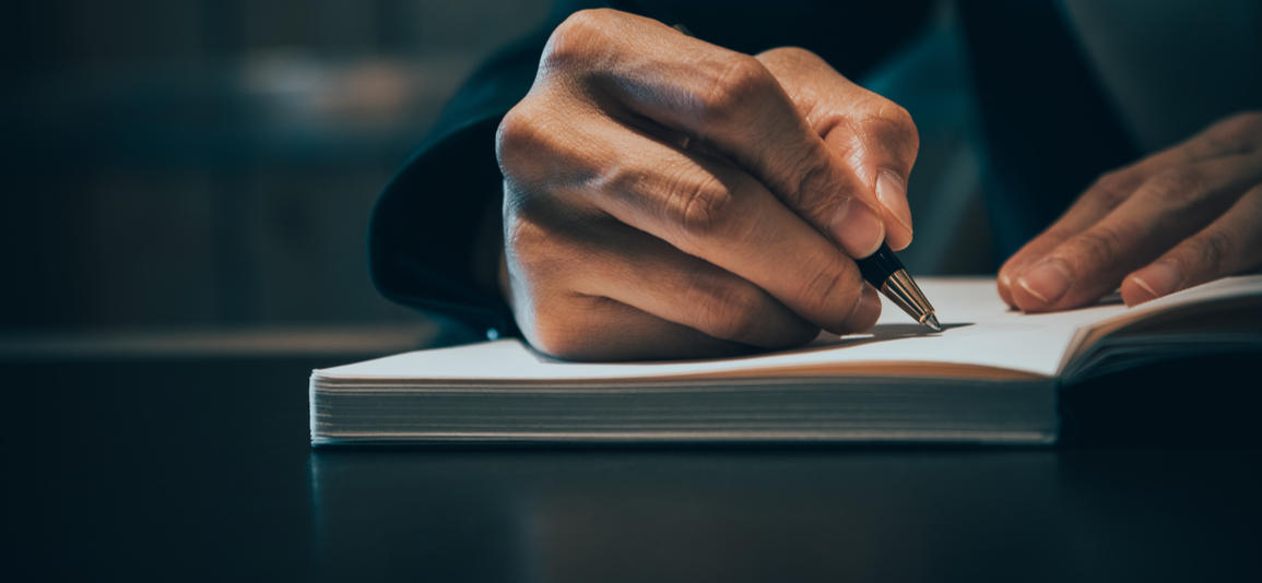 close up image of business person writing