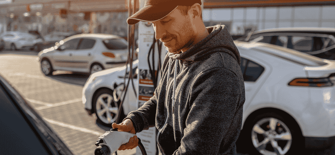 Man holding power charging cable electric