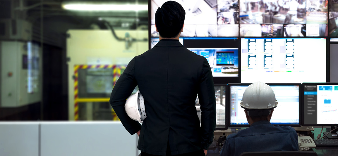 Engineer and director manager monitoring real time work automation machine process