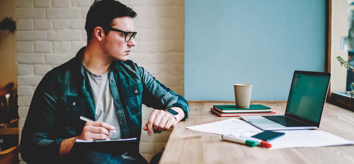 man studying on laptop