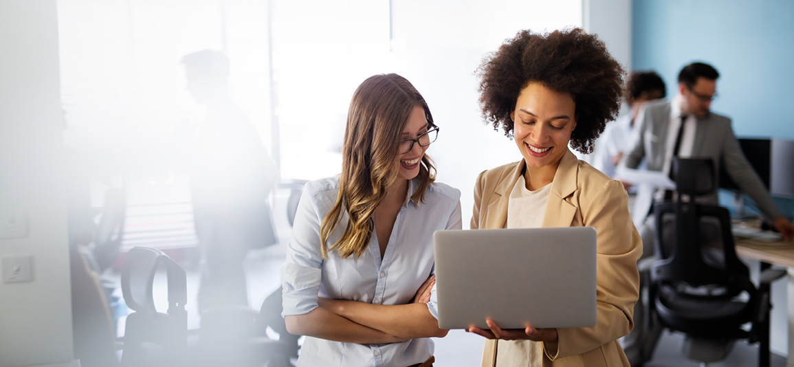 smiling business women working together in office