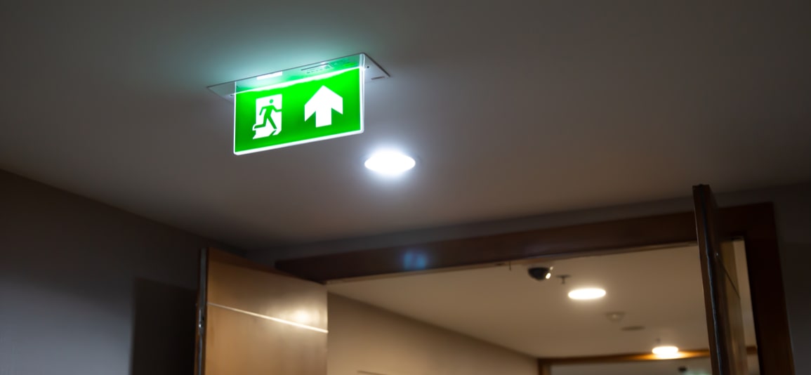 Close up the green emergency fire exit sign