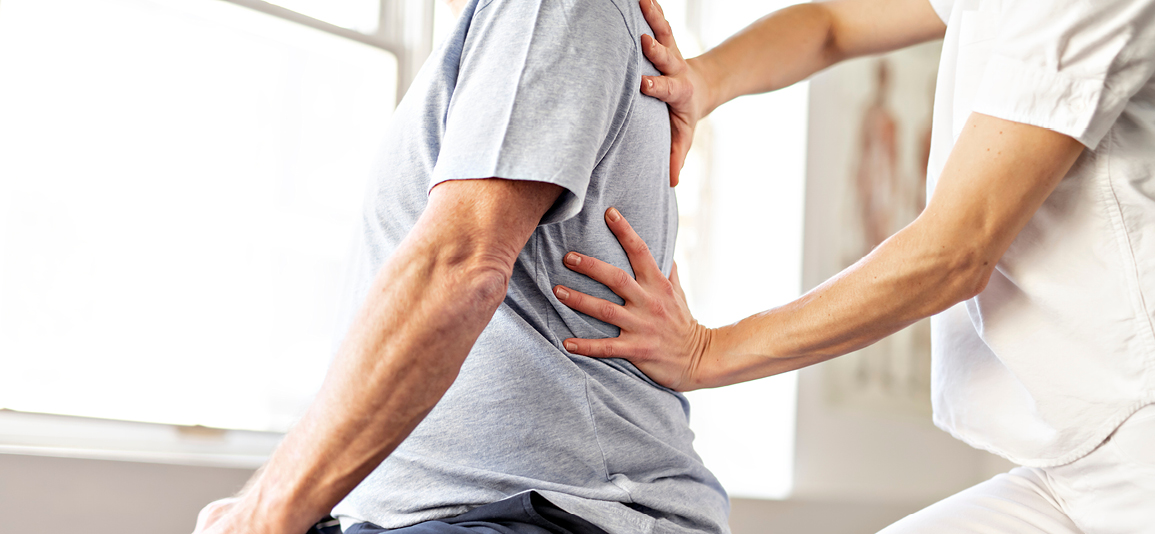 A Modern rehabilitation physiotherapy worker with senior client