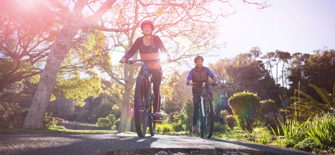 Low angle view biker couple cycling