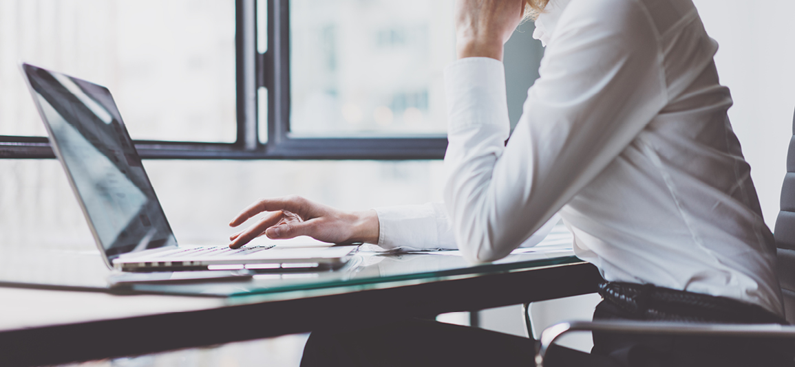 Young Woman Account Manager Working at Wood Table with New Business Project