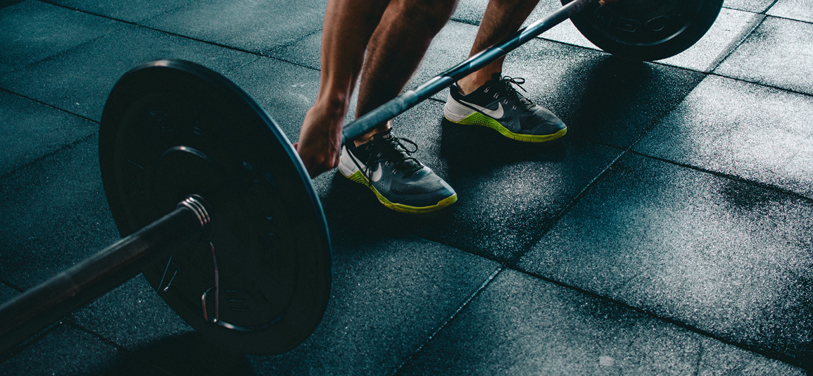Person Holding Barbell