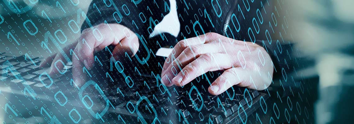 Hands on a keyboard in a cyber attack