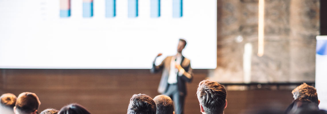 Speaker giving a talk in conference hall at business event