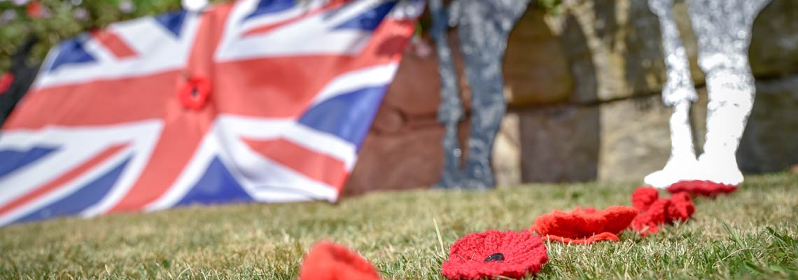 British flag with poppy's on decorations in the garden