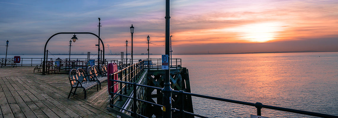 A pier at sunset