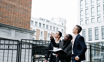 Three businessmen visiting the construction site