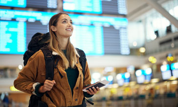 happy young woman at the airport