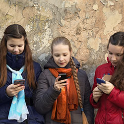 Young girls using their phones