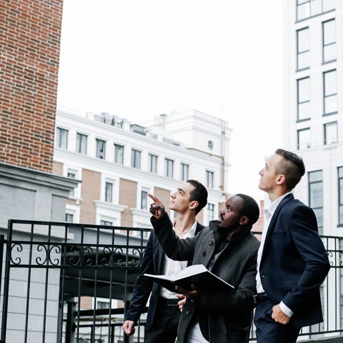 Three businessmen visiting the construction site