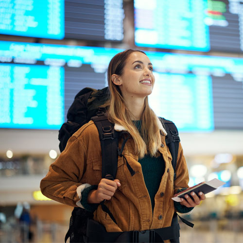 happy young woman at the airport